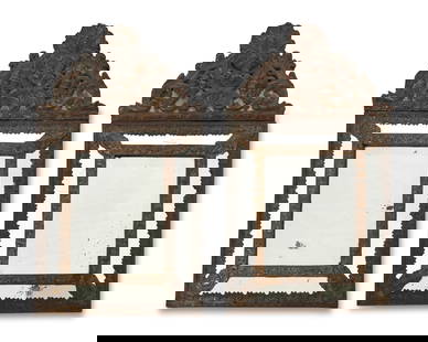 A pair of Flemish-style cushion wall mirrors: A pair of Flemish-style cushion wall mirrorsEach appears unmarkedTwo multi-paneled beveled mirrors with foliate stamped repoussE brass overlay, each mounted on a wood support for hanging, 2 piecesEach