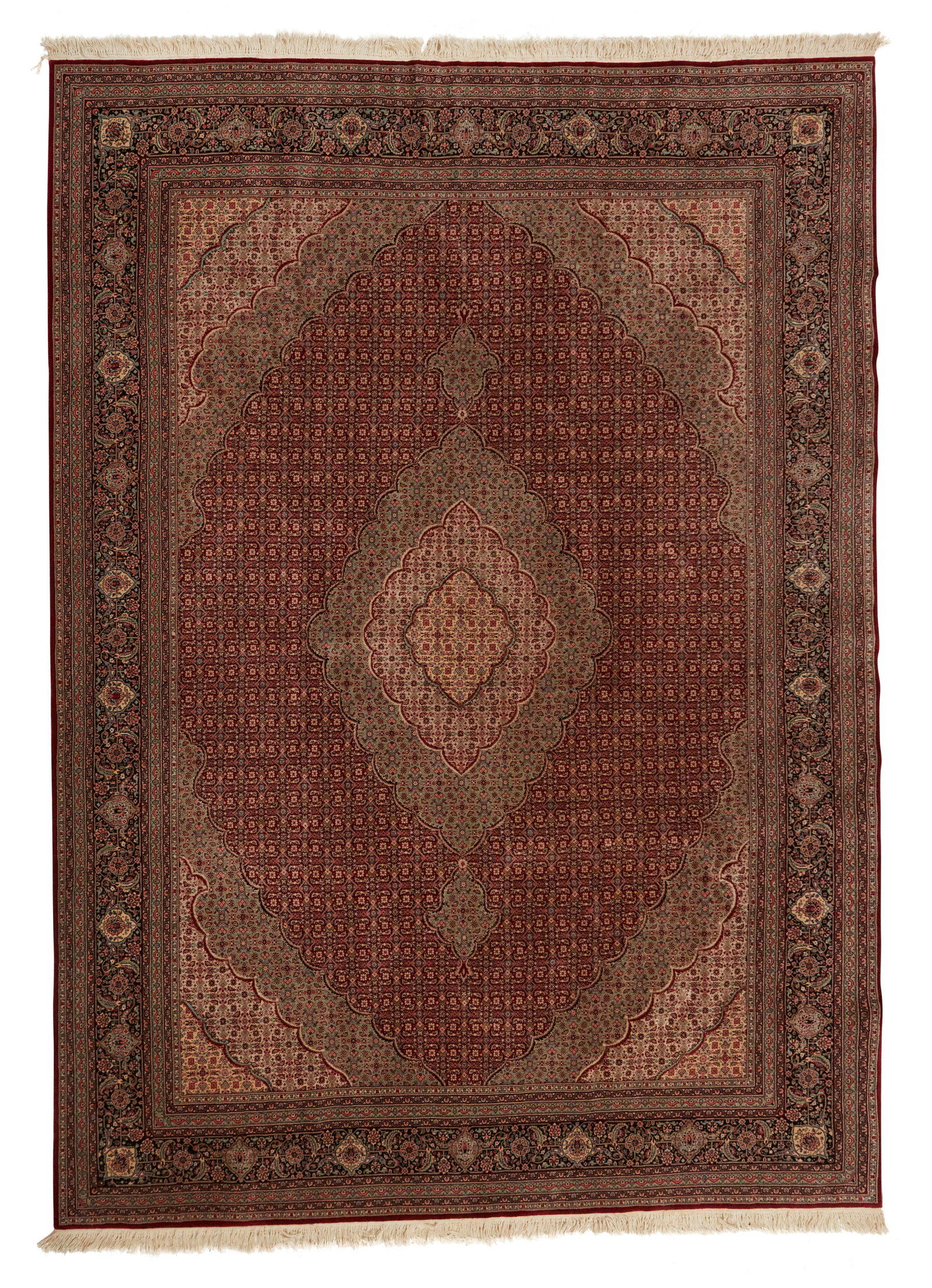 A Persian area rug: A Persian area rug Mid/late 20th century The wool on cotton foundation rug with all-over polychrome foliate motifs centering a medallion on a burgundy ground 12' H x 8' 9" W