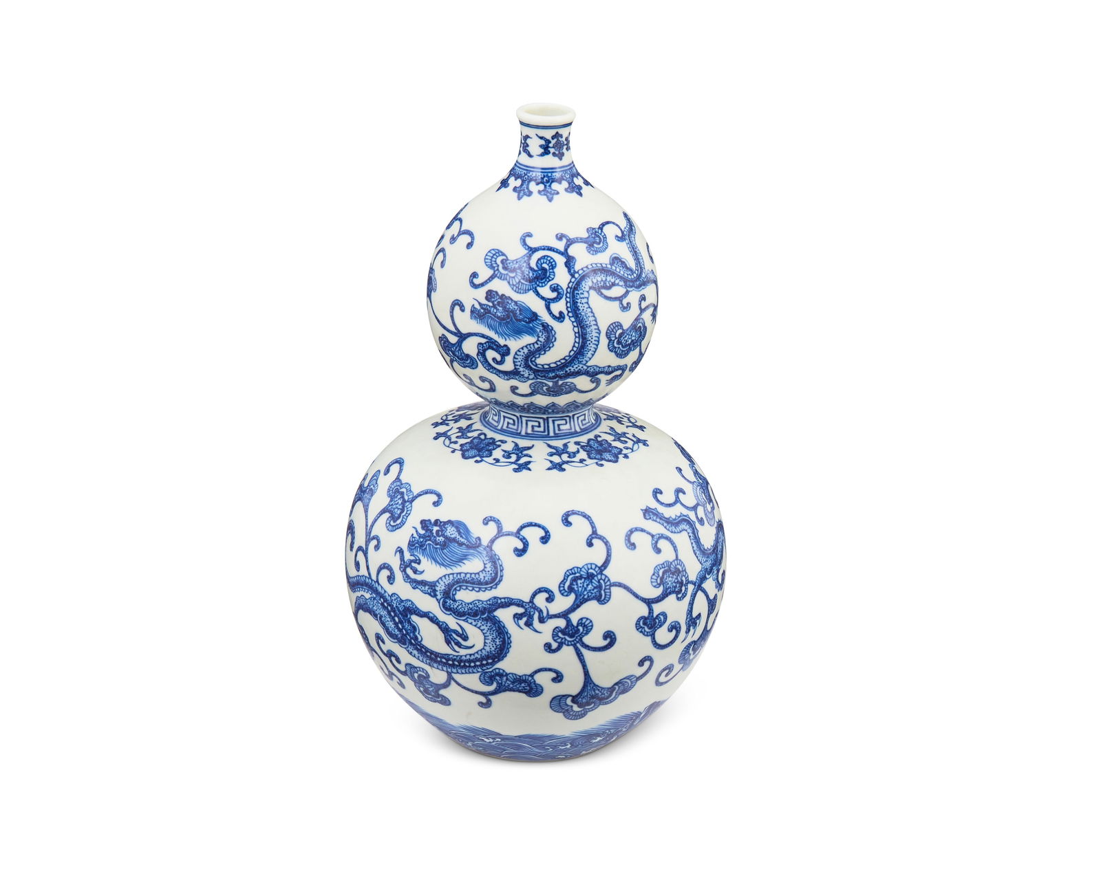 A Chinese blue and white double-gourd porcelain vase: A Chinese blue and white double-gourd porcelain vase20th centuryMarked to the underside in blue underglaze bearing an apocryphal reign mark for Qianlong Period (1736-1795)With an all-over dragon and s