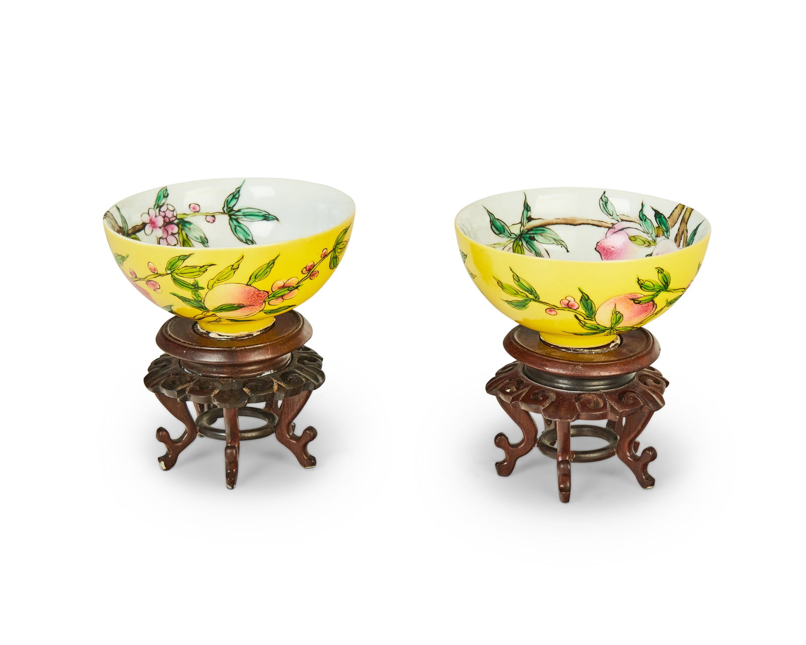 A pair of Chinese porcelain peach bowls: A pair of Chinese porcelain peach bowls 20th century Each marked to the underside in blue underglaze bearing an apocryphal reign mark for Yongzheng Period (1723-1735) Each with all-over enameling depi