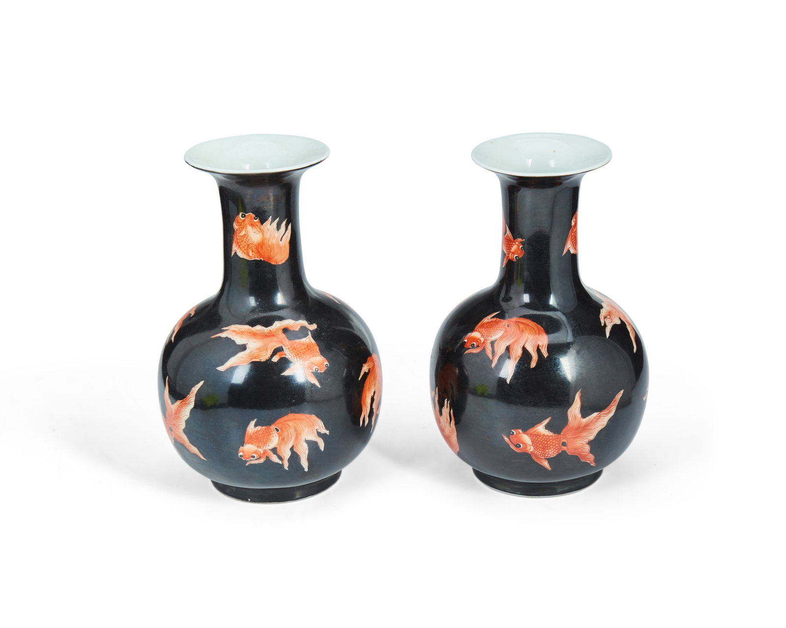 A pair of Chinese goldfish motif porcelain vases: A pair of Chinese goldfish motif porcelain vases Late 20th century Marked to underside in red enamel: Huaguang Tang Zhi The globular vase with attenuated and flared neck featuring goldfish on a black 