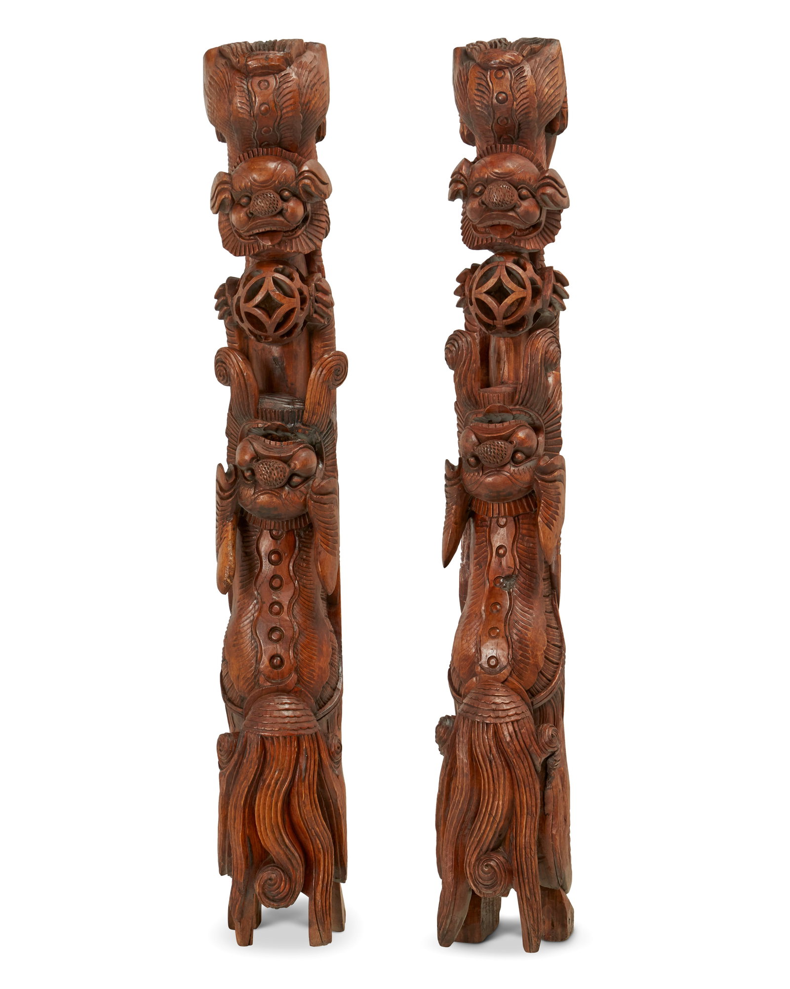 A pair of Chinese Huizhou-style carved wood corbels: A pair of Chinese Huizhou-style carved wood corbels Mid/late Qing Dynasty (1644-1912) Each appear unmarked Comprising two carved softwood architectural mounts, each depicting guardian lions with their