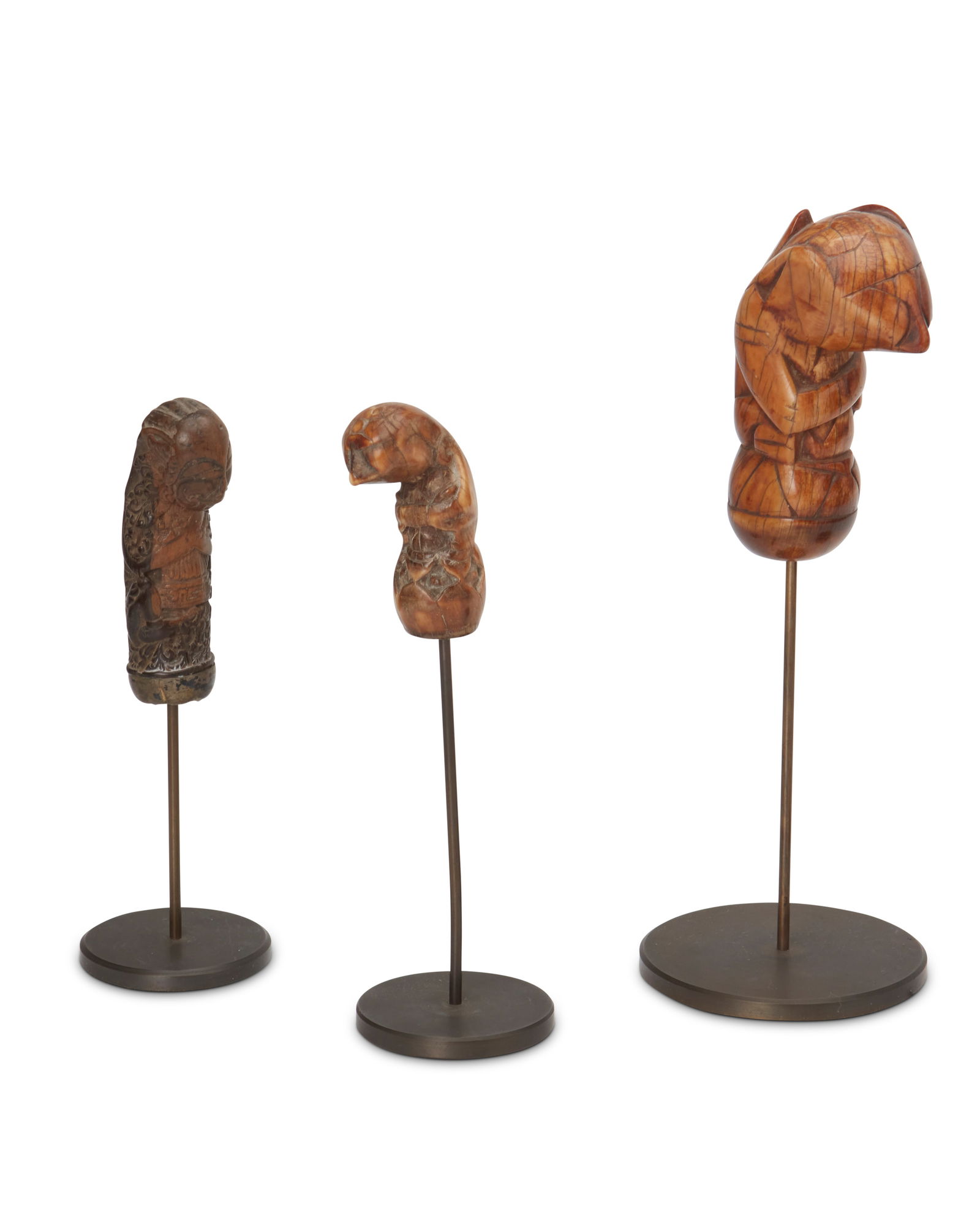 Three Indonesian carved wood hilts for ceremonial daggers (kris) (1 of 4)