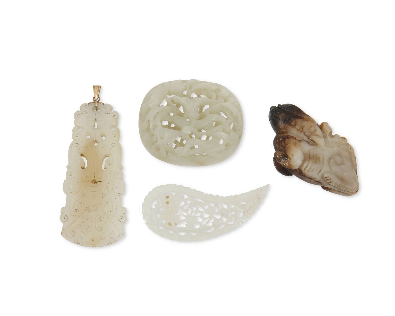 A group of four carved jade decorations (1 of 2)