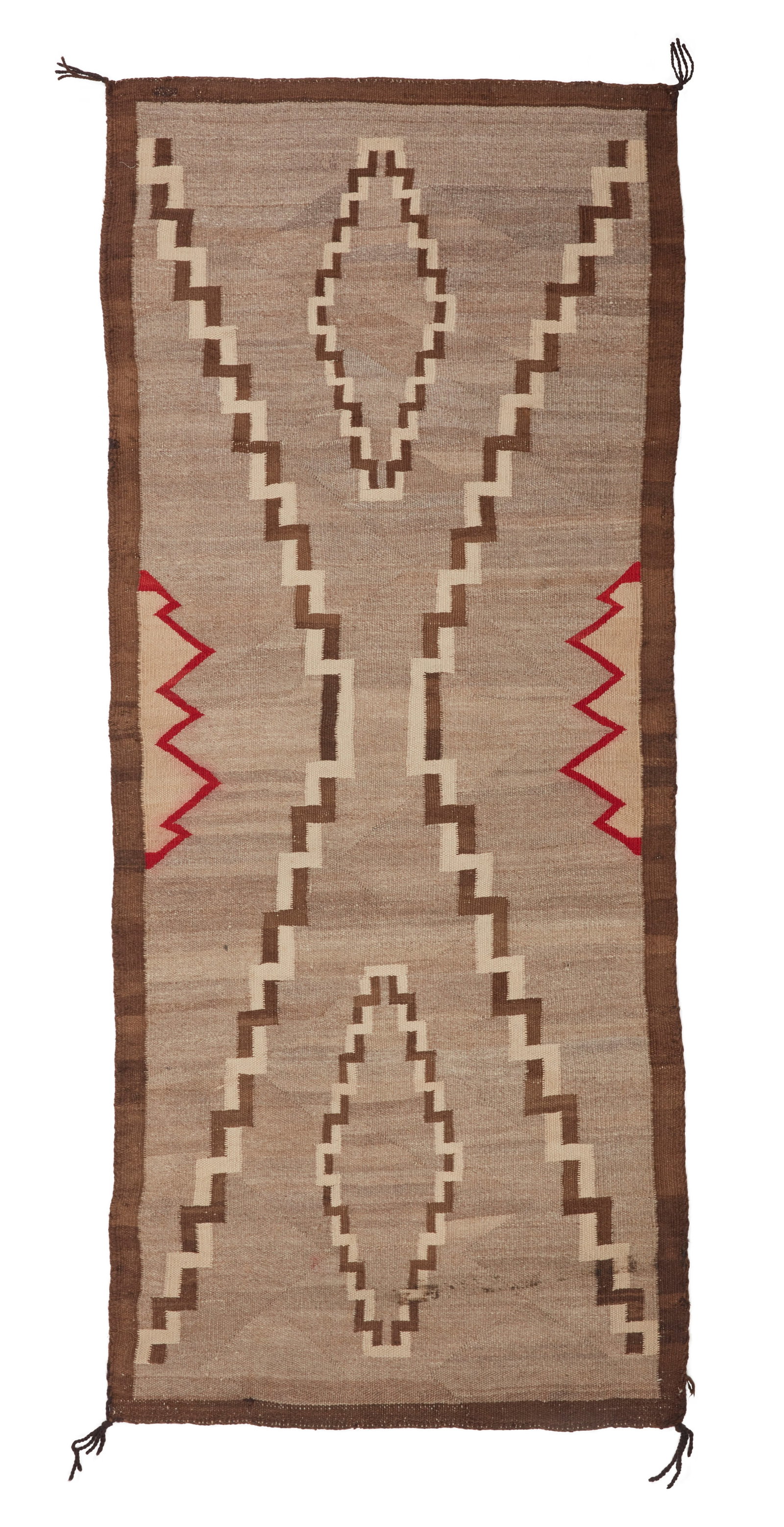 A Navajo regional rug: A Navajo regional rug Early/mid-20th century, DinE Woven in natural grey, cream, brown, and red wool with a central interlaced checkered X motif and floating stepped diamonds 69" H x 31" W