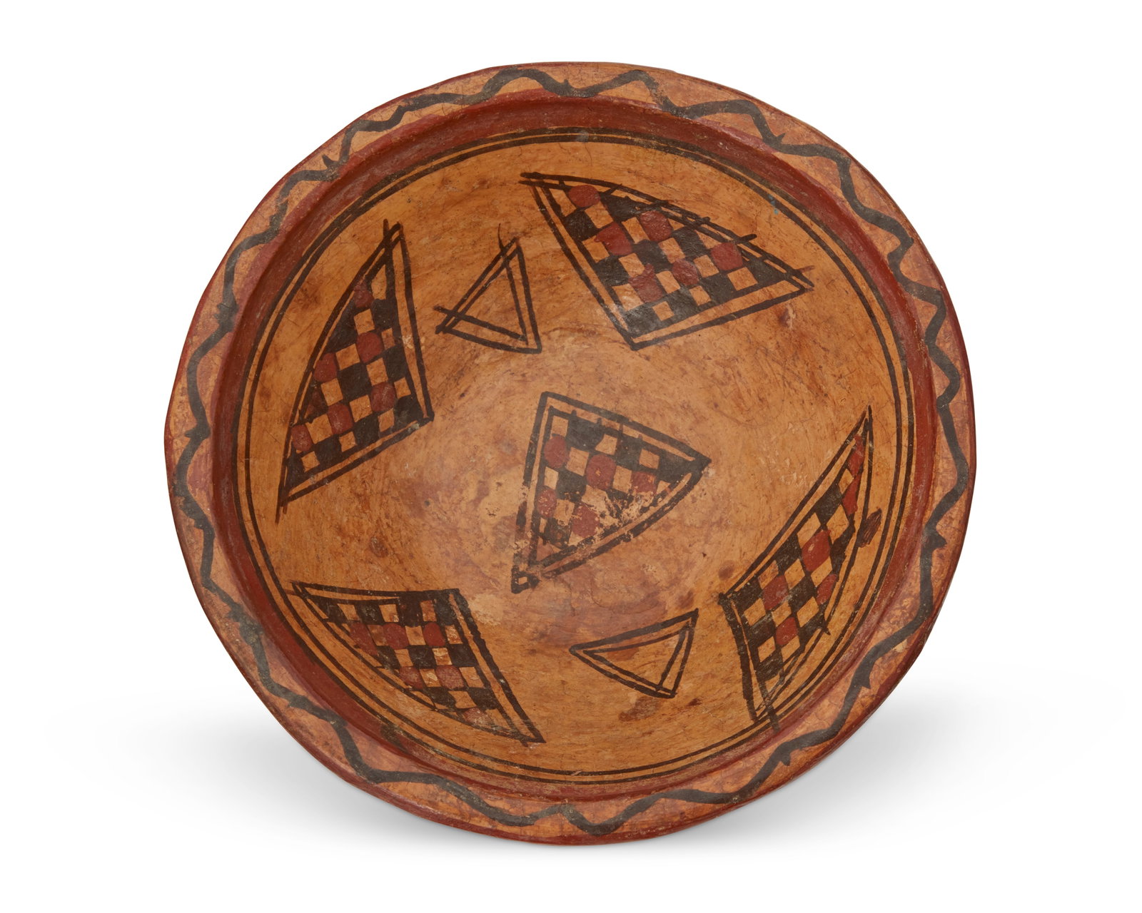 A Southwest polychrome pottery bowl: A Southwest polychrome pottery bowl Late 19th/early 20th century Unmarked The possibly Puebloan three-color varnished bowl with checkered triangle motifs 2.5" H x 7.5" Dia. Provenance: Priva