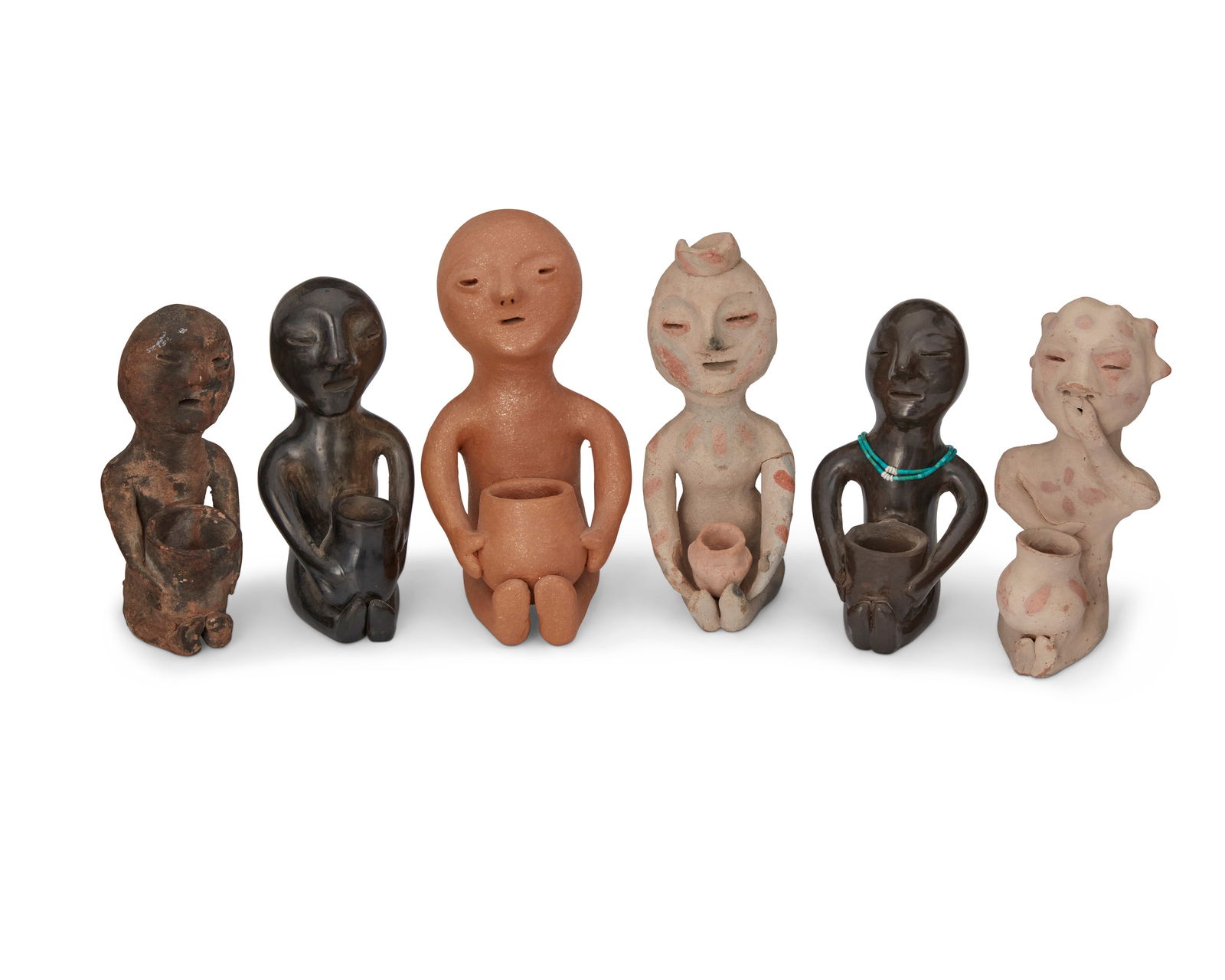 A group of Puebloan pottery rain god figures (1 of 5)