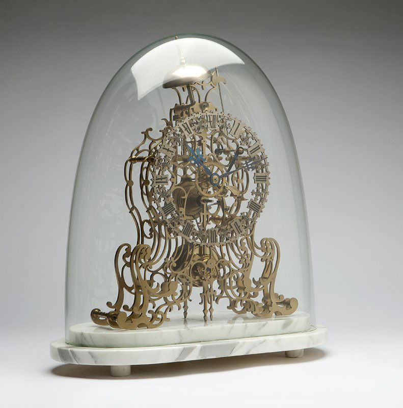 A James Smith & Sons brass skeleton clock: Circa 1845, English, etched signature to support plate ''Smith & Sons / Clerkenwell'', the circular pierced silvered dial with black Roman numerals and blued steel hands, with lead pendulum bob and oa