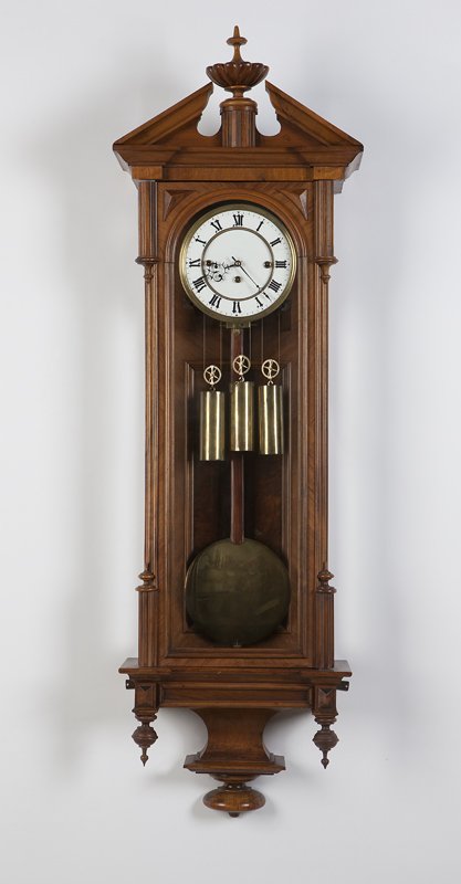 A Vienna wall regulator: Third quarter 19th century, unmarked, the circular white porcelain double sunken dial with black Roman numeral chapters and minute indices, black skeletonized hands and brass bezels, attached to a thr