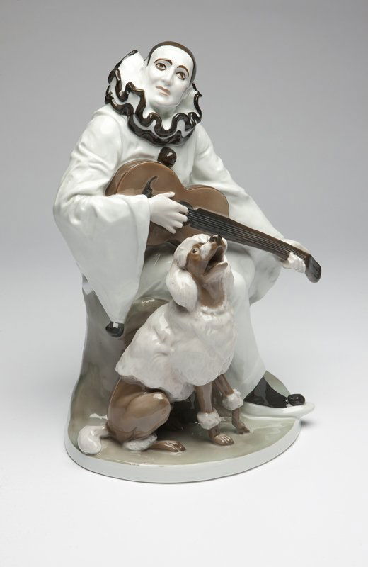 An R. Marcuse Rosenthal porcelain figure group: First quarter 20th century, designed 1913, with green underglaze ''Rosenthal / Selb-Bavaria'' mark, impressed to rear ''Rudolf Marcuse / -1913-'', depicting Pierrot playing guitar beside a poodle on a