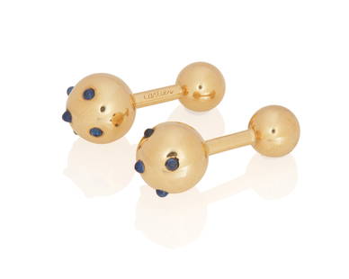 A Pair of Gold and Sapphire Cufflinks, Cartier: A Pair of Gold and Sapphire Ball Cufflinks, Cartier The ball cufflinks feature cabochon cut sapphires, in 14K gold, signed Cartier and numbered. 2 pieces 10.4 grams 1 1/4" L Provenance: