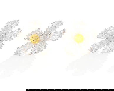 A Pair of Diamond Earrings, Bulgari: A Pair of Colored Diamond and Diamond Earrings, BulgariCentering a round brilliant-cut fancy vivid yellow diamond weighing .17 carat and a round brilliant-cut fancy vivid orangy yellow diamond weighin