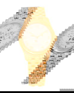 A Gold Triple Calendar and Moonphases, Patek Philippe: A Gold Triple Calendar and Moonphases Wristwatch, Patek PhilippeRef: 5036/1R 001Dial: White with luminescent gold Roman numerals and dart hands, aperture for date and moonphase at 6 o'clock, registers