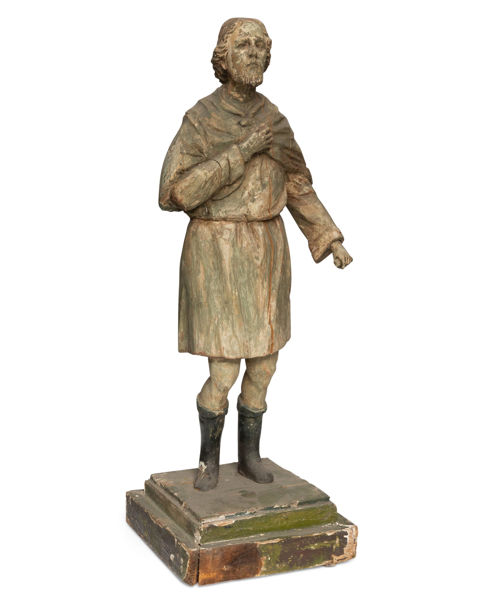 A carved wood santos figure: A carved wood santos figure 18th century Appears unmarked A polychrome carved and painted wood figure with a cloak and possibly holding a small scroll [possibly St. Paul] 28.5" H x 10" W x 1