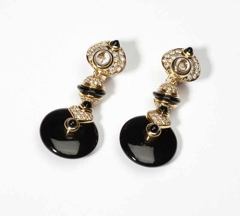 A pair of gold, onyx, diamond & gem-set earrings: 18K gold pendant drops with black onyx disc dangles set with a total of 122 full-cut round diamonds totaling approximately 1.75 cts, graded G-H color and VS clarity with a colorless gem cabochon, 2'',
