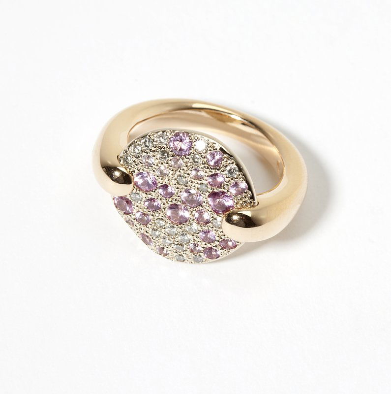 A pink sapphire and diamond ring, Pomellato: Signed Pomellato, Sabbia, 18K gold with a round disc pave-set with full-cut diamonds and pink sapphires, size 5.25, 15.7 gms, est:$1000/1500 Provenance: Property of a Private Pasadena, CA Collector