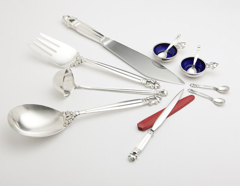 Georg Jensen 'Acorn' sterling serving pieces: Designed by Johan Rohde circa 1915, with maker's mark, second half 20th century, further marked 'Sterling Denmark', comprising: a large serving spoon (9''), a large 4-tine cold meat serving fork (9'')