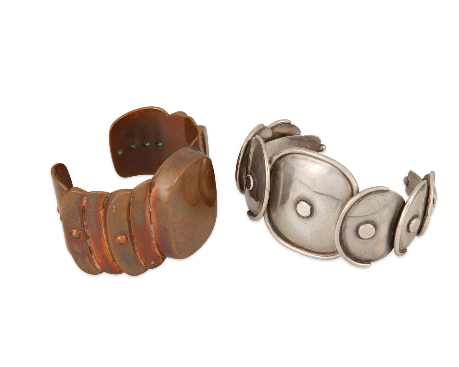 Two Mexican cuff bracelets: Two Mexican cuff braceletsMid-20th centuryOne stamped: Sterling / TaxcoTwo works comprising a sterling silver "Armadillo" cuff bracelet in the style of Hector Aguilar (7.25" total inner