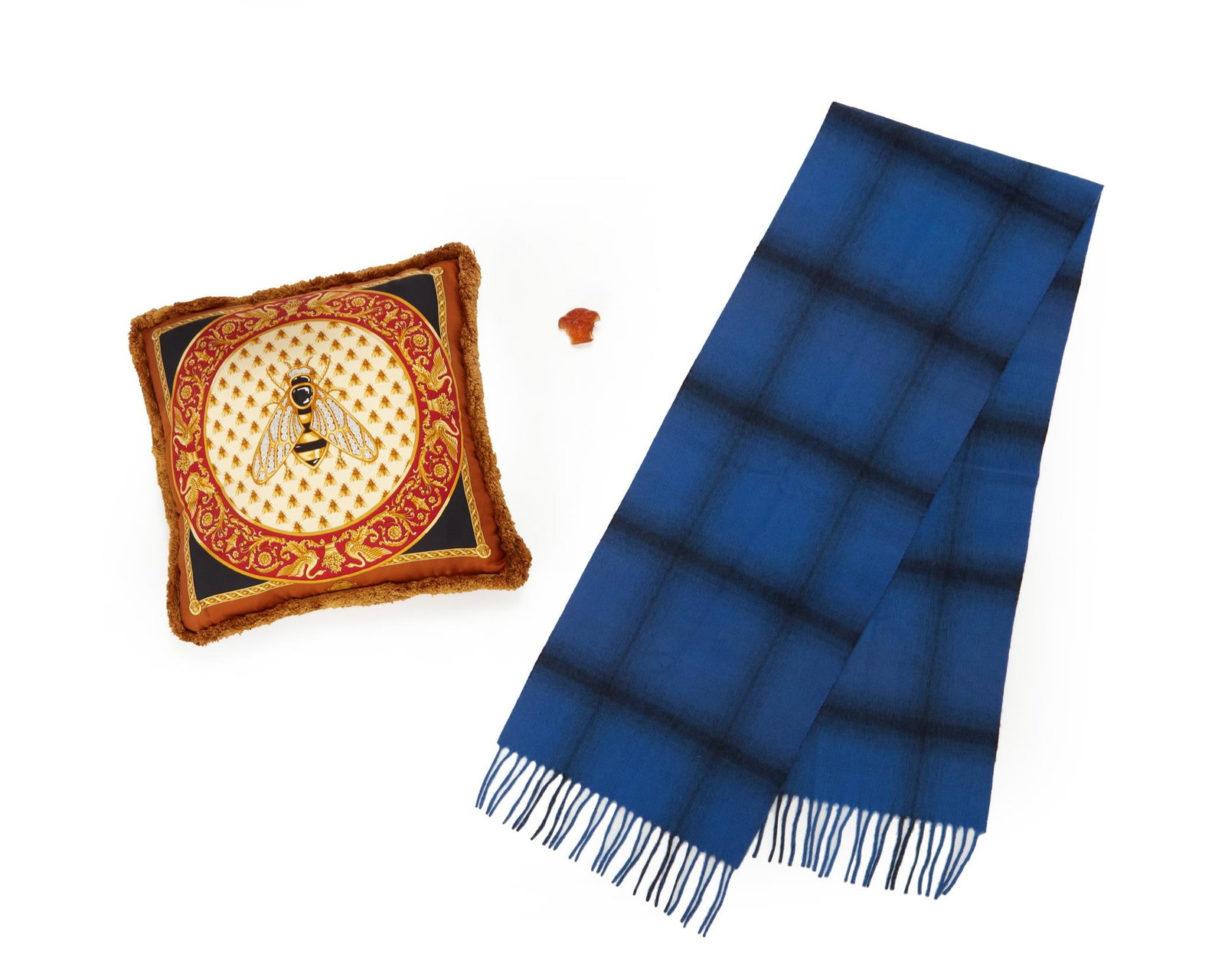 A group of Atelier Versace items: A Group of Atelier Versace ItemsLate 20th/early 21st centuryIncluding an Atelier Versace silk twill fringed bee cushion with zip closure and removable inner cushion, printed with Atelier Versace logo