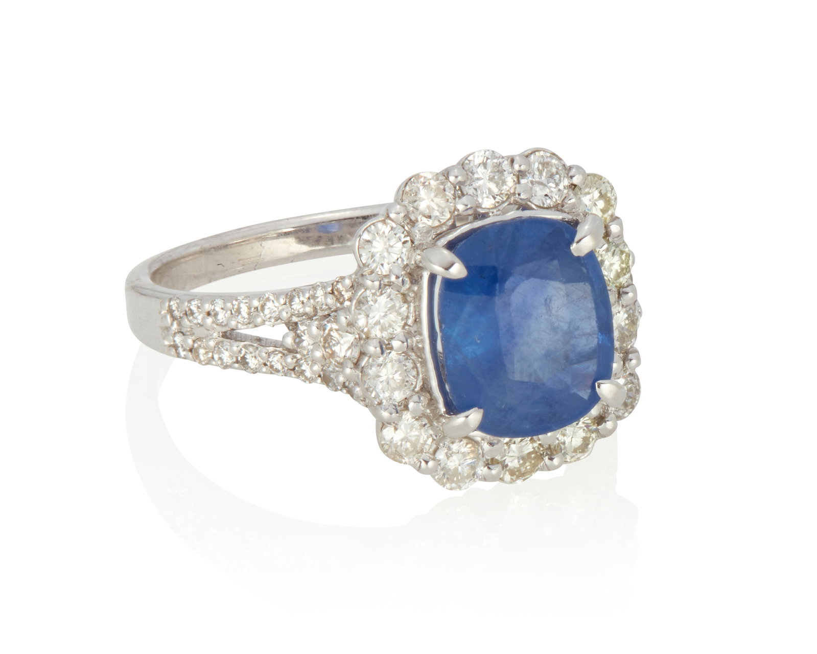 A Sapphire and Diamond Ring: A Sapphire and Diamond Ring Set with a cushion-shaped sapphire measuring approximately 8.78 mm x 7.35 mm x 4.27 mm and weighing approximately 2.49 carats, surrounded by 46 round brilliant-cut diamonds