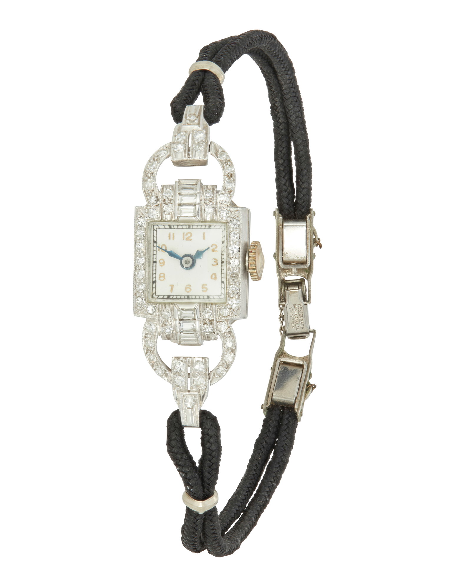 A Diamond and Platinum Lady's Wristwatch: A Diamond and Platinum Lady's Wristwatch The cocktail watch includes 64 round brilliant-cut and baguette-cut diamonds weighing approximately .64 carat, set in platinum. 7" L