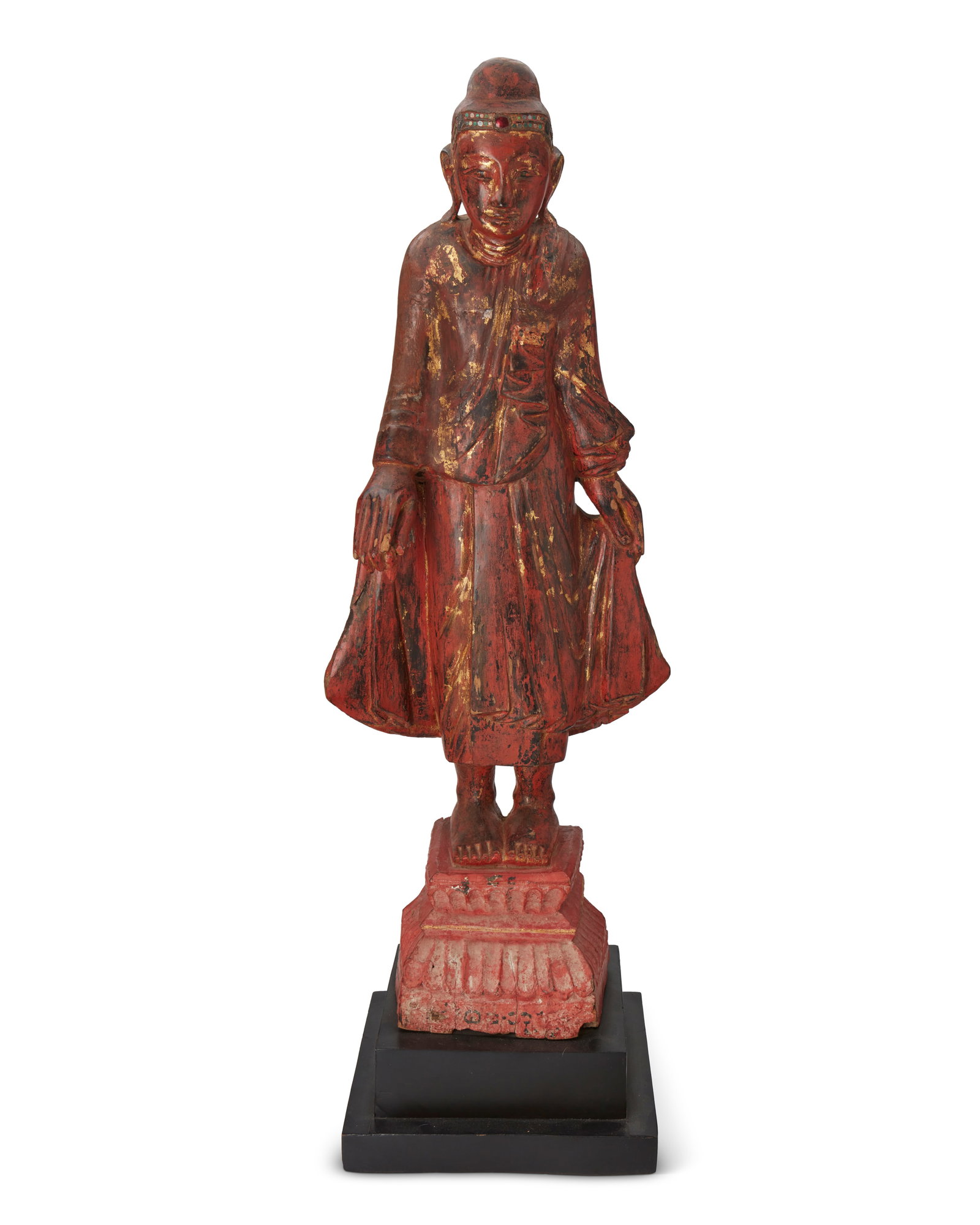 A Burmese carved and giltwood Mandalay Buddha: A Burmese carved and giltwood Mandalay Buddha Late 19th/Early 20th century; Mayanmar Marked with inscribed indecipherable characters in red paint on the base verso The carved wood standing Buddha figu