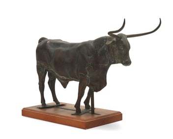 A copper longhorn cow figure