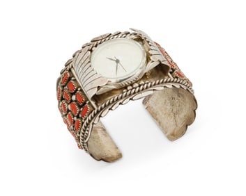 A sterling silver Zuni Pueblo coral watch cuff