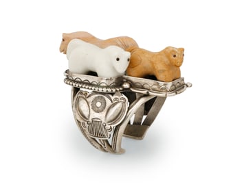 An Art Tafoya cuff bracelet with carved stone horse fetish figures