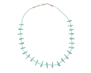 A Zuni Pueblo style carved turquoise fetish necklace