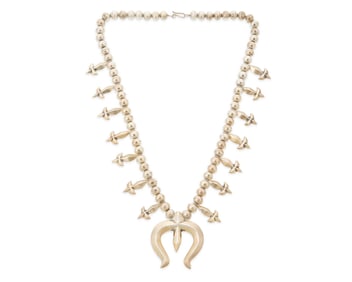 A Southwest sandcast sterling silver squash blossom necklace