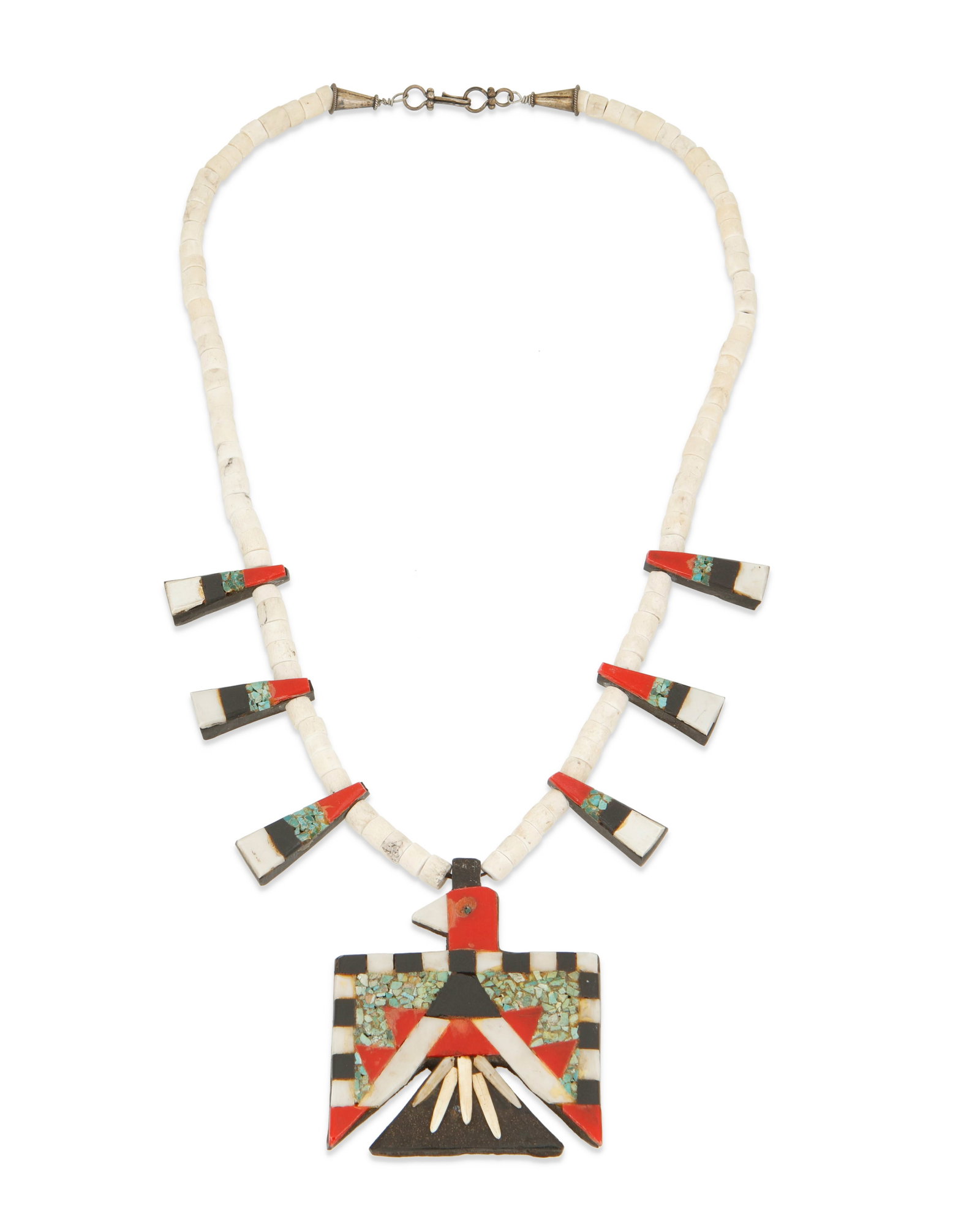 A Santo Domingo Pueblo "Battery Bird" necklace: A Santo Domingo Pueblo "Battery Bird" necklace Early 20th century, Kewa Appears unmarked A single strand necklace with inlaid tabs and central Thunderbird pendant, all in various materials s