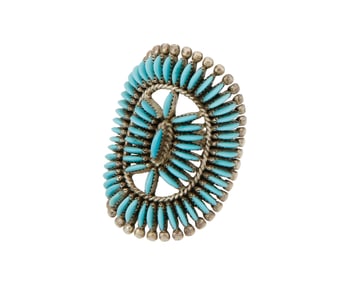 An Edith Tsabetsaye Zuni silver and petit point turquoise ring