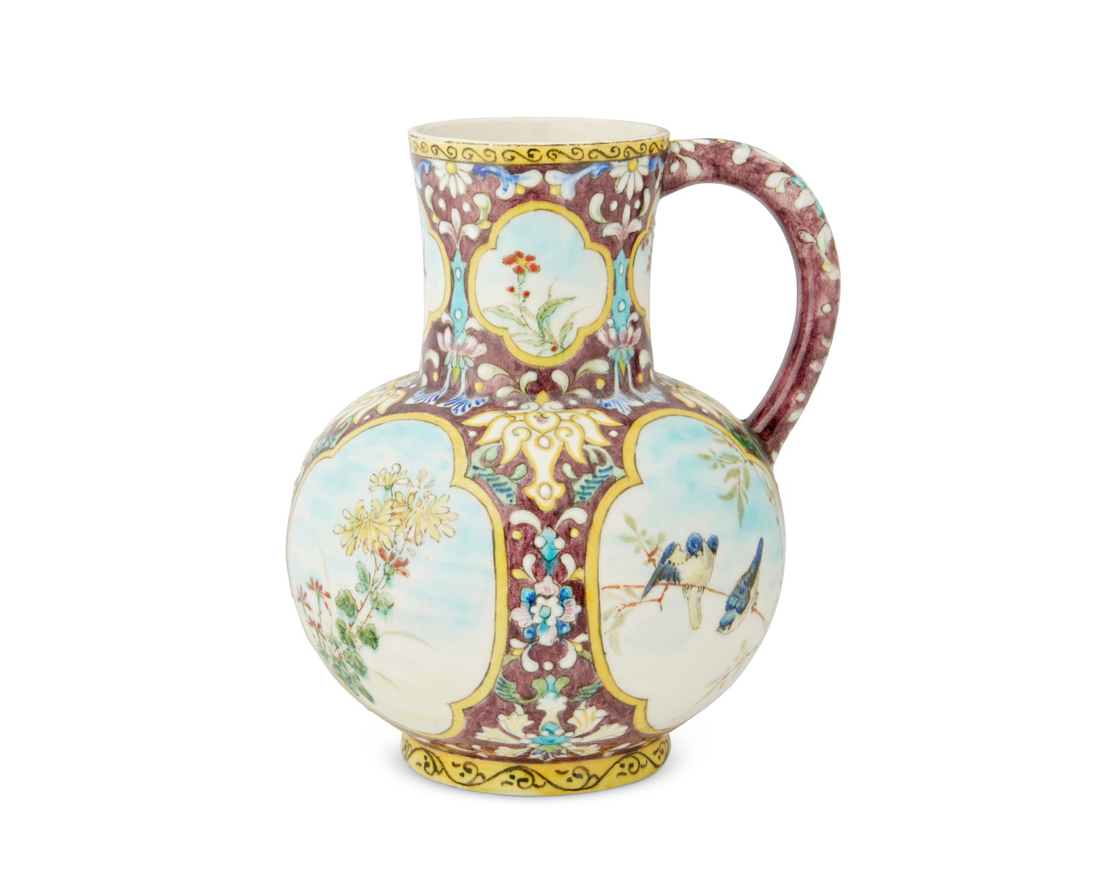 A Theodore Deck ceramic pitcher: A Theodore Deck ceramic pitcherLate 19th CenturyMarked in red underglaze to underside: TH DECKThe Theodore Deck (1823-1891) Chinese-style glazed ceramic handled pitcher featuring floral and avian moti