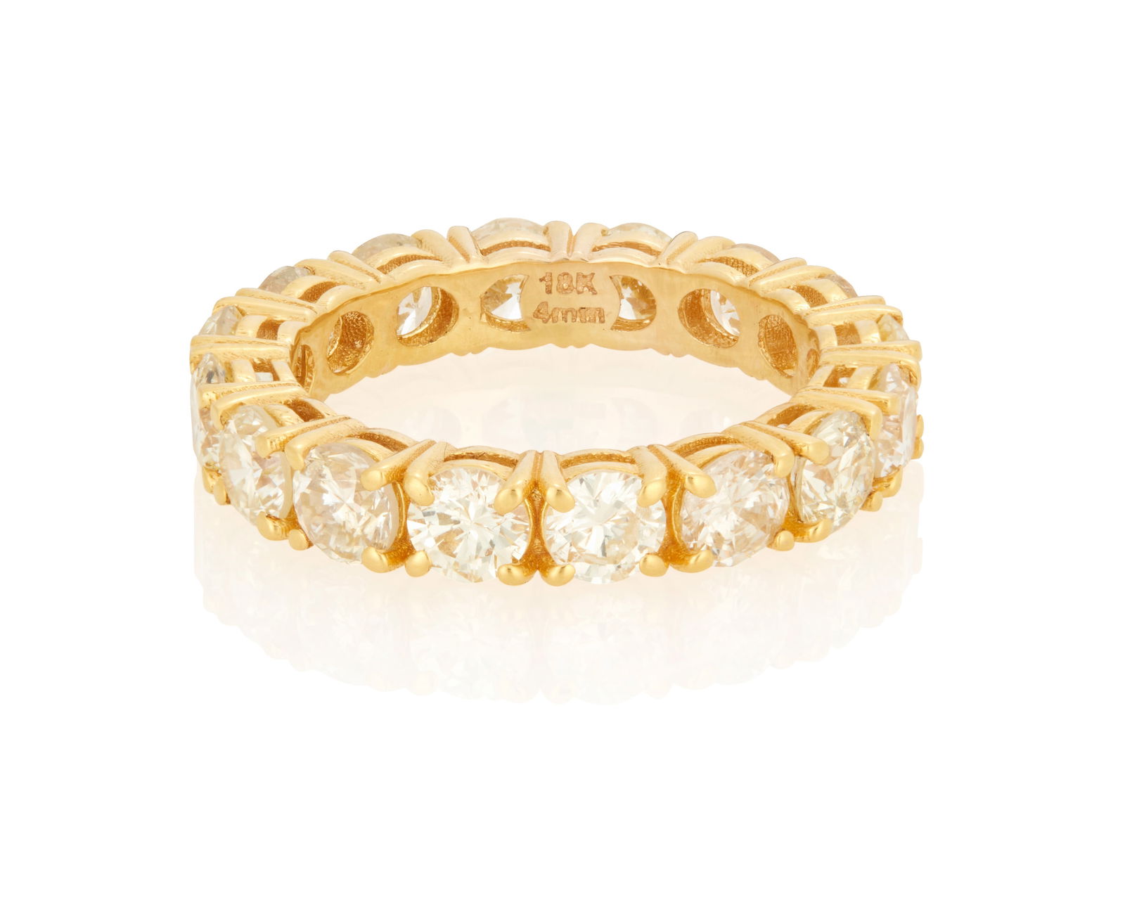 A Diamond Eternity Band: A Diamond Eternity BandComprising 17 round brilliant-cut diamonds totaling 4.10 carats, set in 18K gold4.2 grams grossRing Size: 6.5