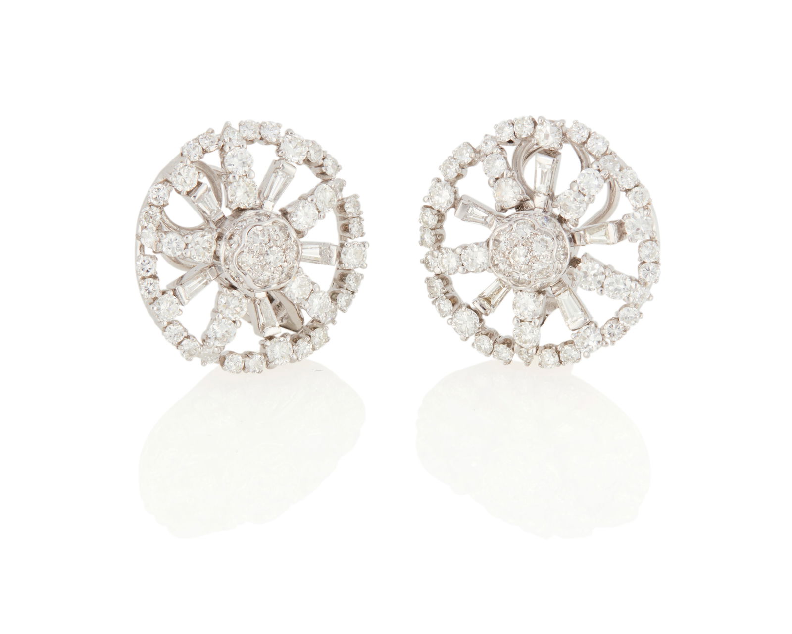 A pair of Diamond Earrings: A pair of Diamond EarringsSet with 94 round brilliant-cut and baguette-cut diamonds weighing approximately 4.50 carats, in white gold18.81 grams gross1.00" Dia Property of a Private Collector