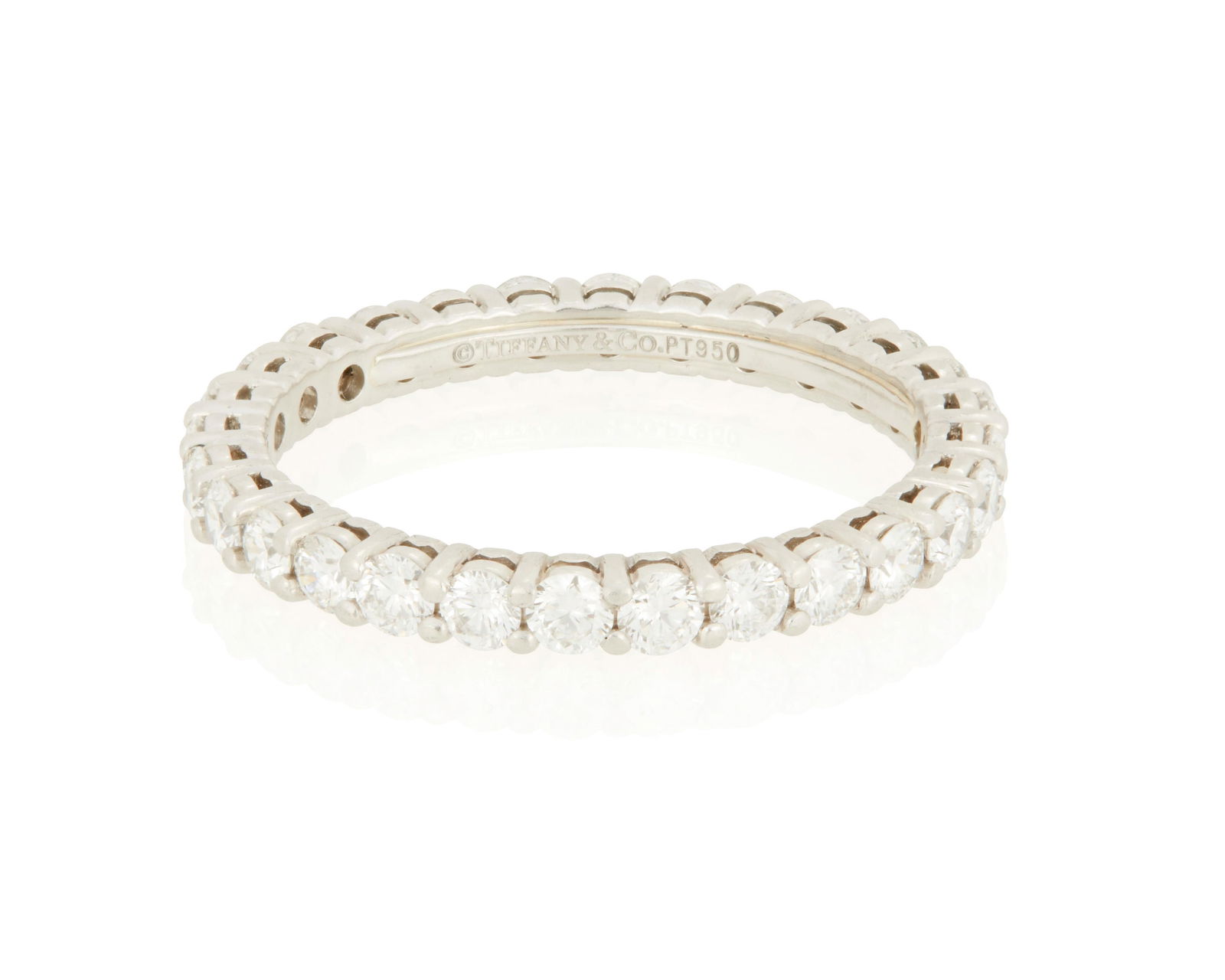A Tiffany & Co. Eternity Band: A Tiffany & Co. Eternity BandSet with 28 round brilliant-cut diamonds weighing approximately 0.86 carat in platinum, signed Tiffany & Co.2.25 grams grossRing Size: 4.75 Property of a Private Collector