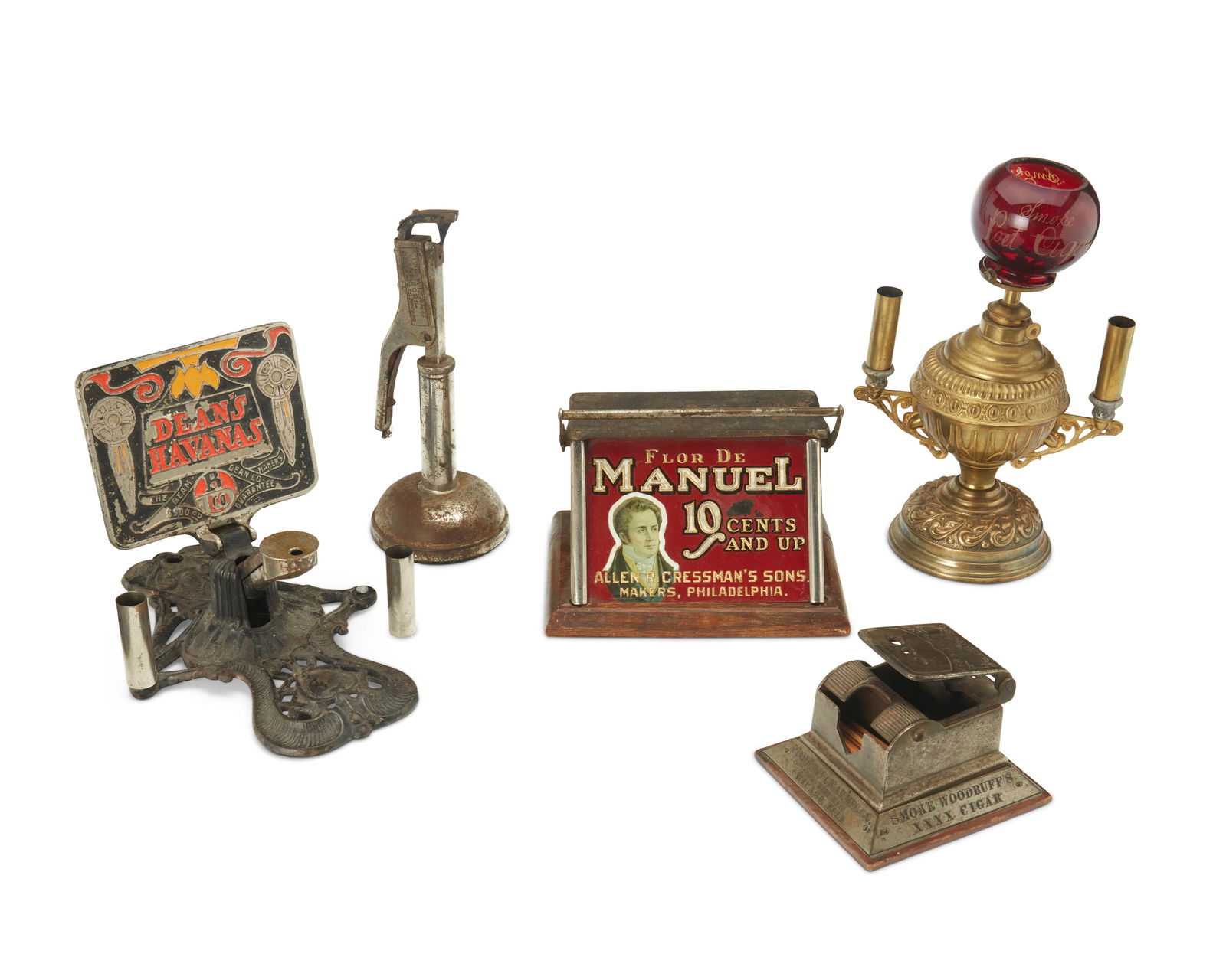 A group of tobacco paraphernalia: A group of tobacco paraphernaliaLate 19th/early 20th centuryOne marked in the casting: Dean's Havanas / The Beam-Dean Co. Makers Guarantee; another marked: Flor De Manuel / 10 Cents and up / Allen R.