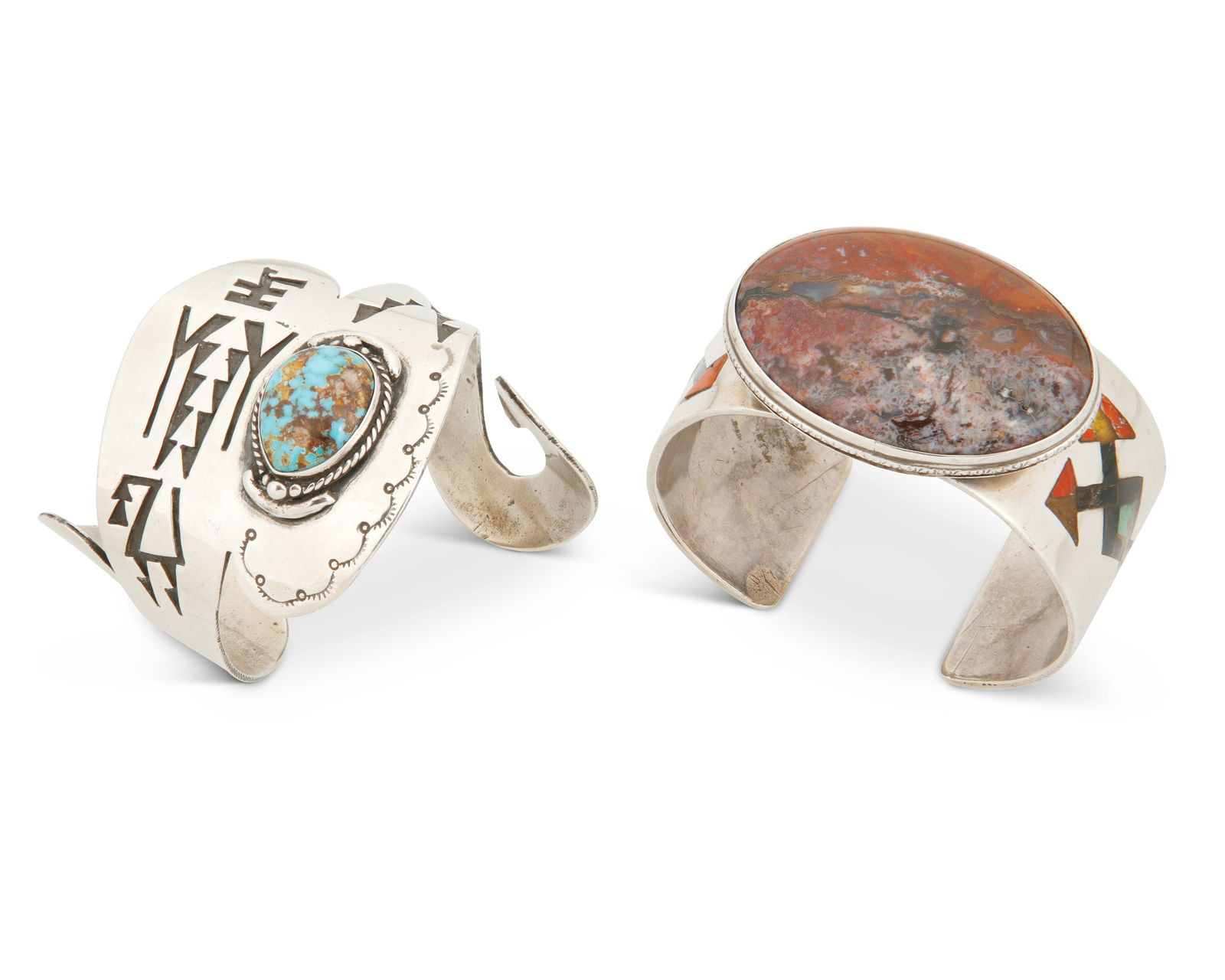 Two Southwest silver and stone cuff bracelets: Two Southwest silver and stone cuff braceletsTwo works:A Southwest-style sterling silver and turquoise cuff braceletMid-20th centuryStamped: RA freeform stamped silver cuff with spiral terminals featu