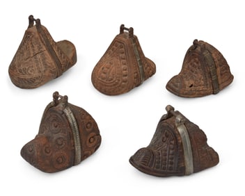 A group of South American carved wood stirrups
