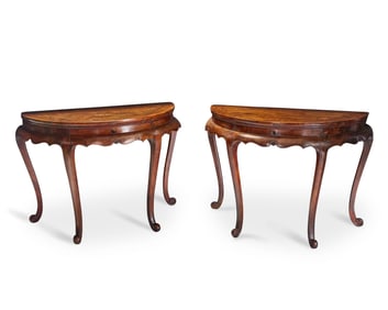 A pair of Chinese demilune tables