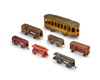 A group of metal passenger railway car toys