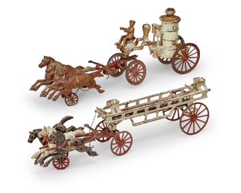 Two cast iron firemen toys
