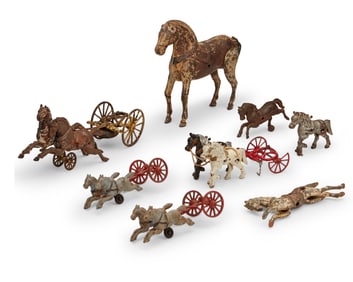 A group of cast iron horse toys