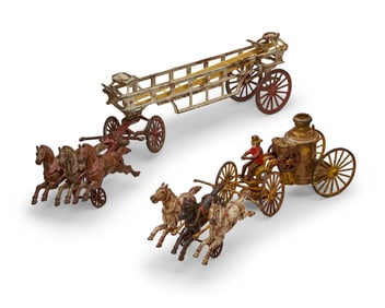 Two cast iron firemen toys