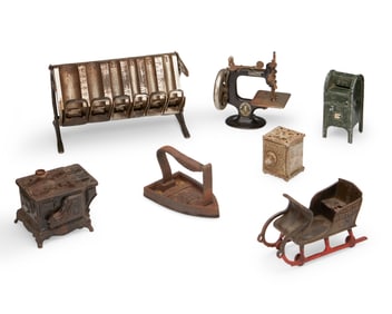 A group of metal miniature toy items