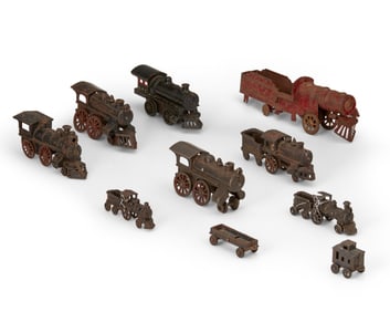 A group of metal toy trains