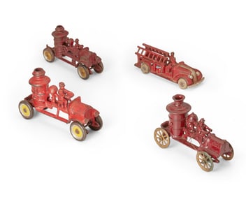 A group of cast iron toy firemen trucks