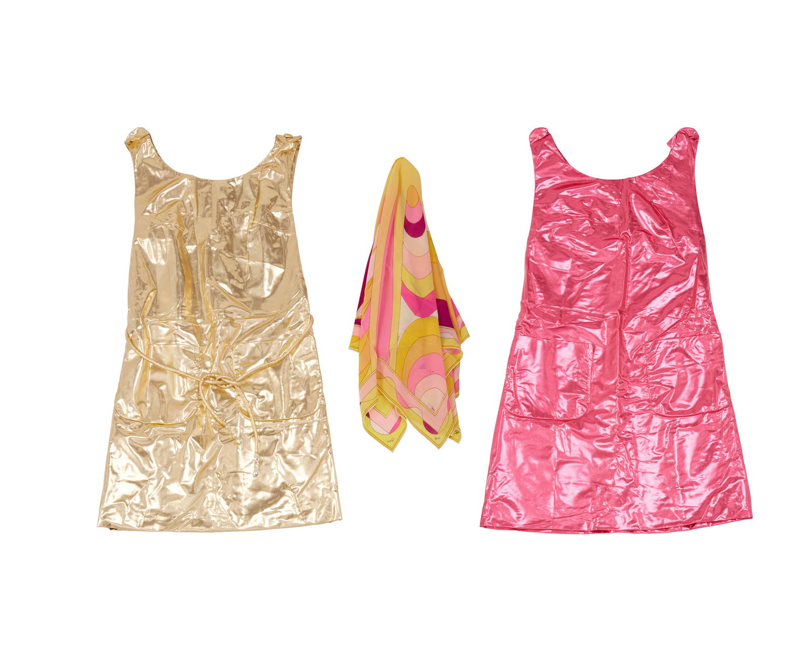 A group of Pucci for Braniff International hostess items: A group of Pucci for Braniff International hostess itemsCirca 1968-1972Aprons labeled: size 6; gold apron with Cohama "Galaxy" label: 100% Nylon / Hand WashableComprising two metallic nylon