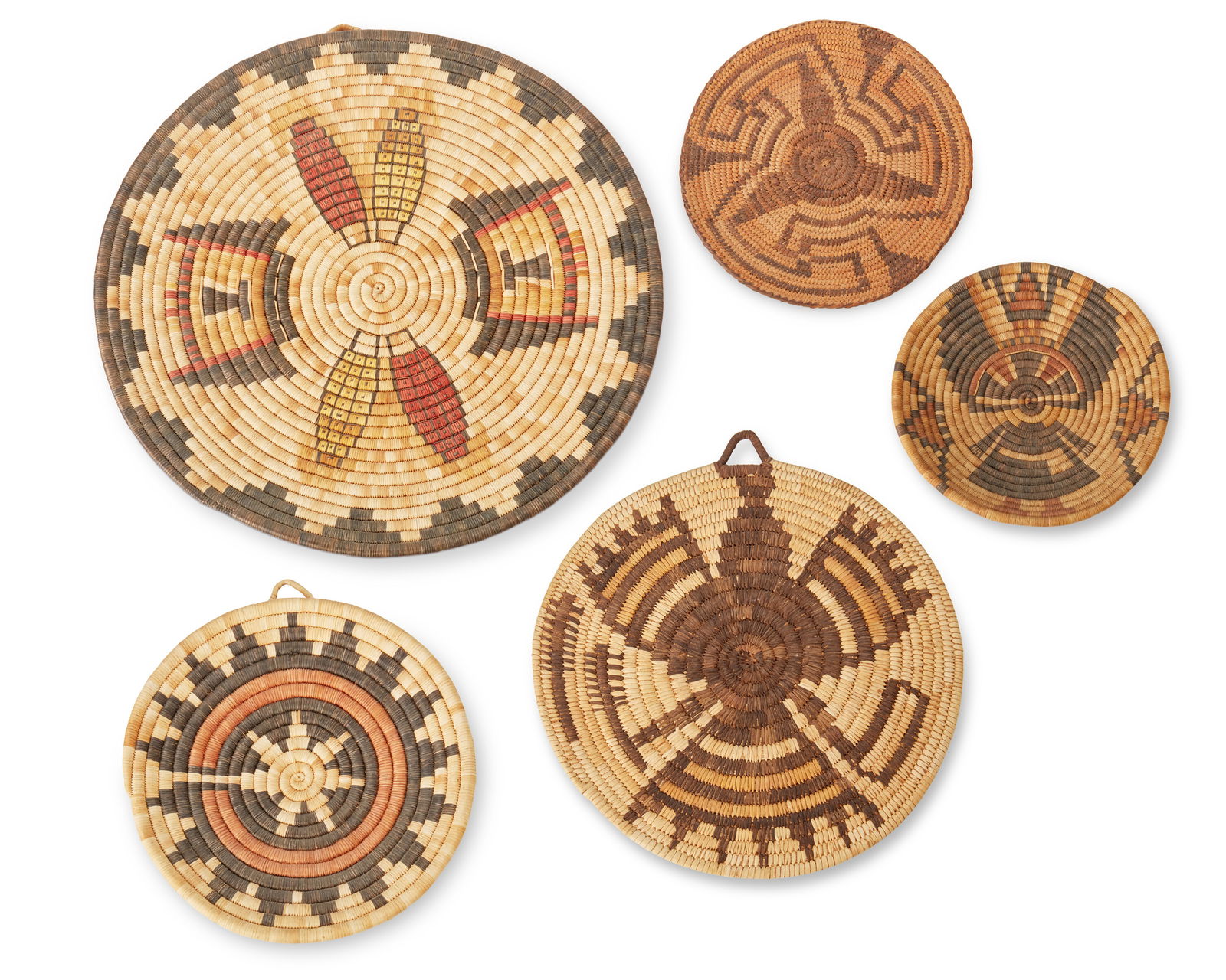 A group of polychrome basketry trays (1 of 12)